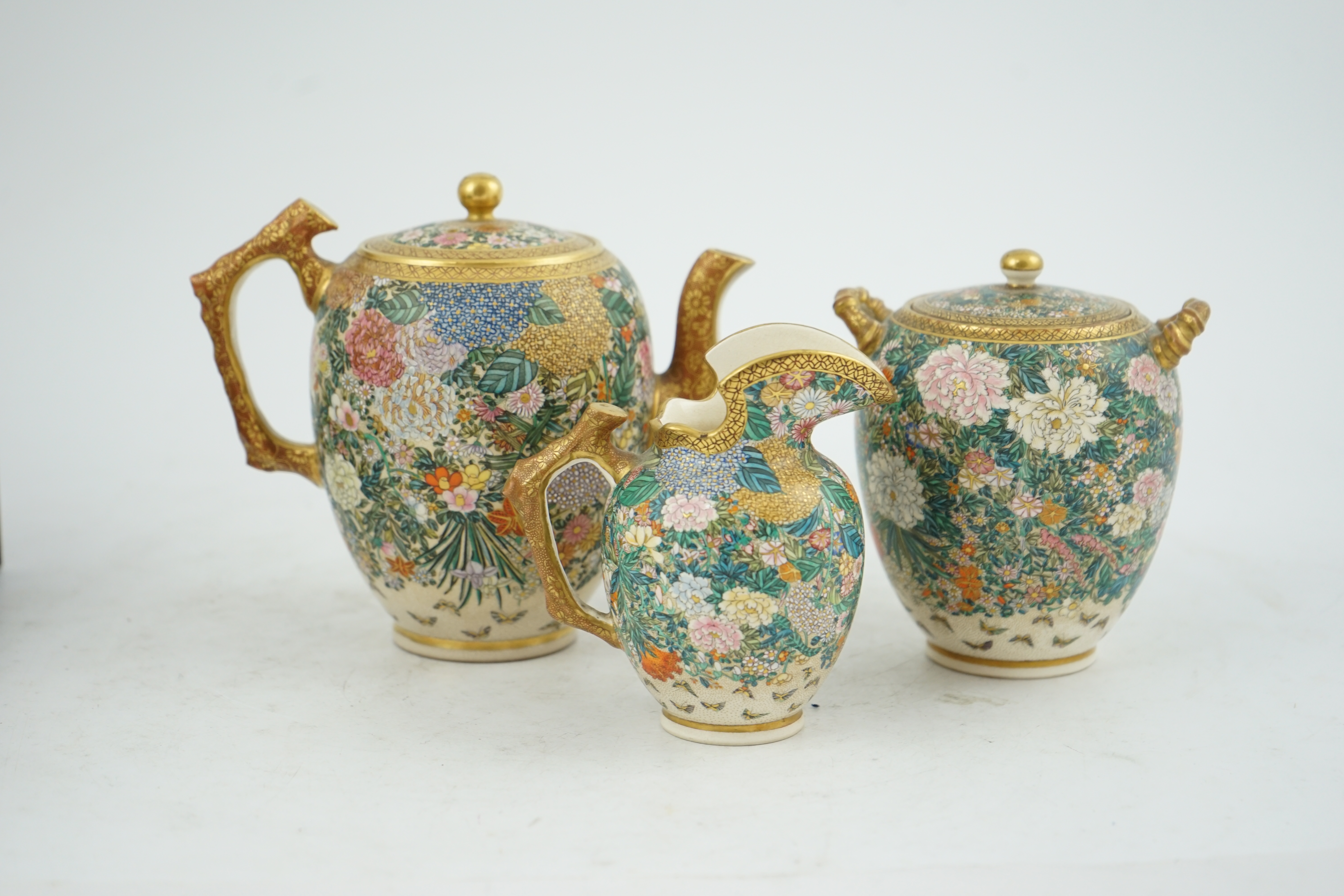 A fine Japanese Satsuma ‘millefleur’ three piece teaset, by Kinkozan, Meiji period